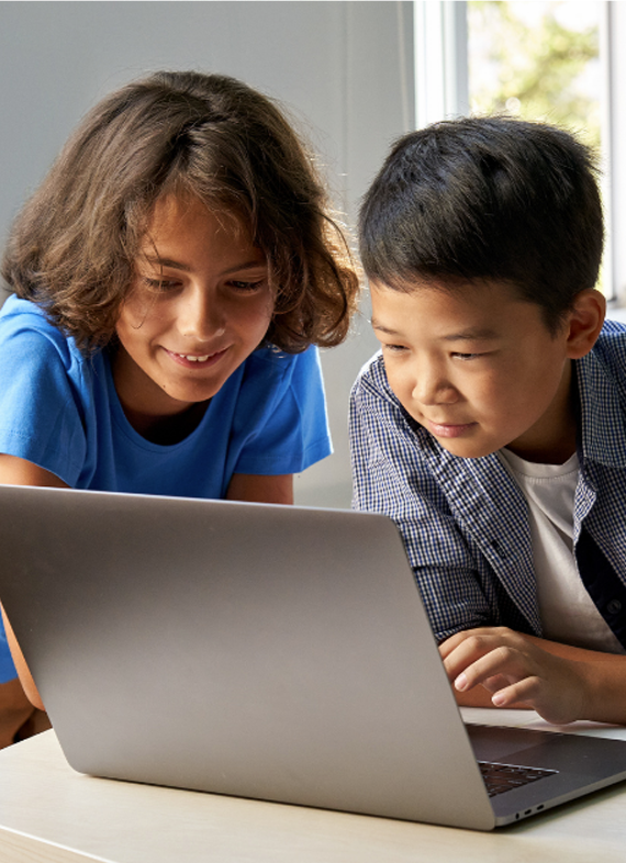 Kids coding on silver laptop